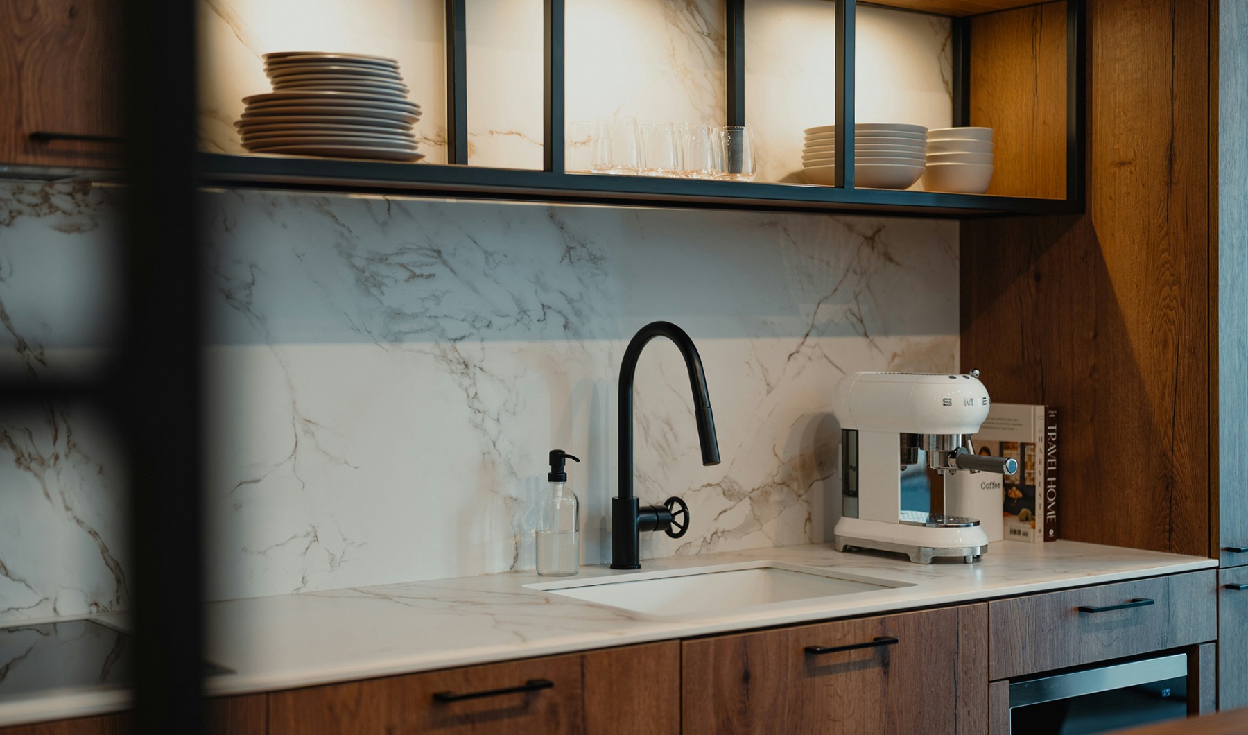 kitchen with ample counter-space, modern appliances and bright lighting