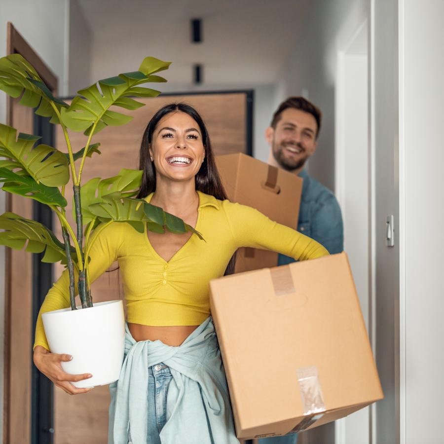a woman holding a box and a man holding a box