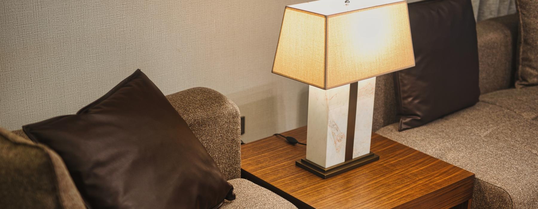 a lamp on a coffee table